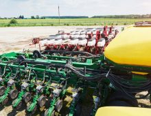 14-close-up-of-seeder-attached-to-tractor-in-field.jpg